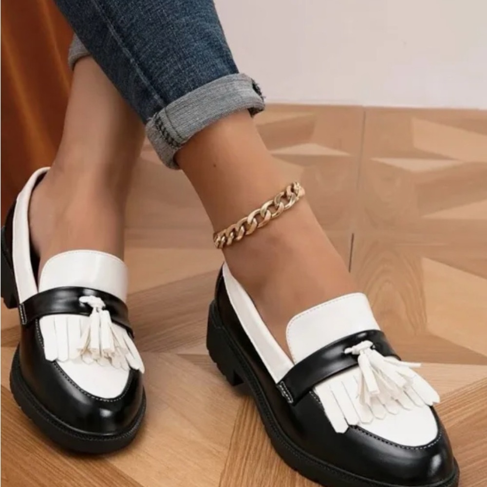 Sleek Black and White Leather Loafers with Tassels